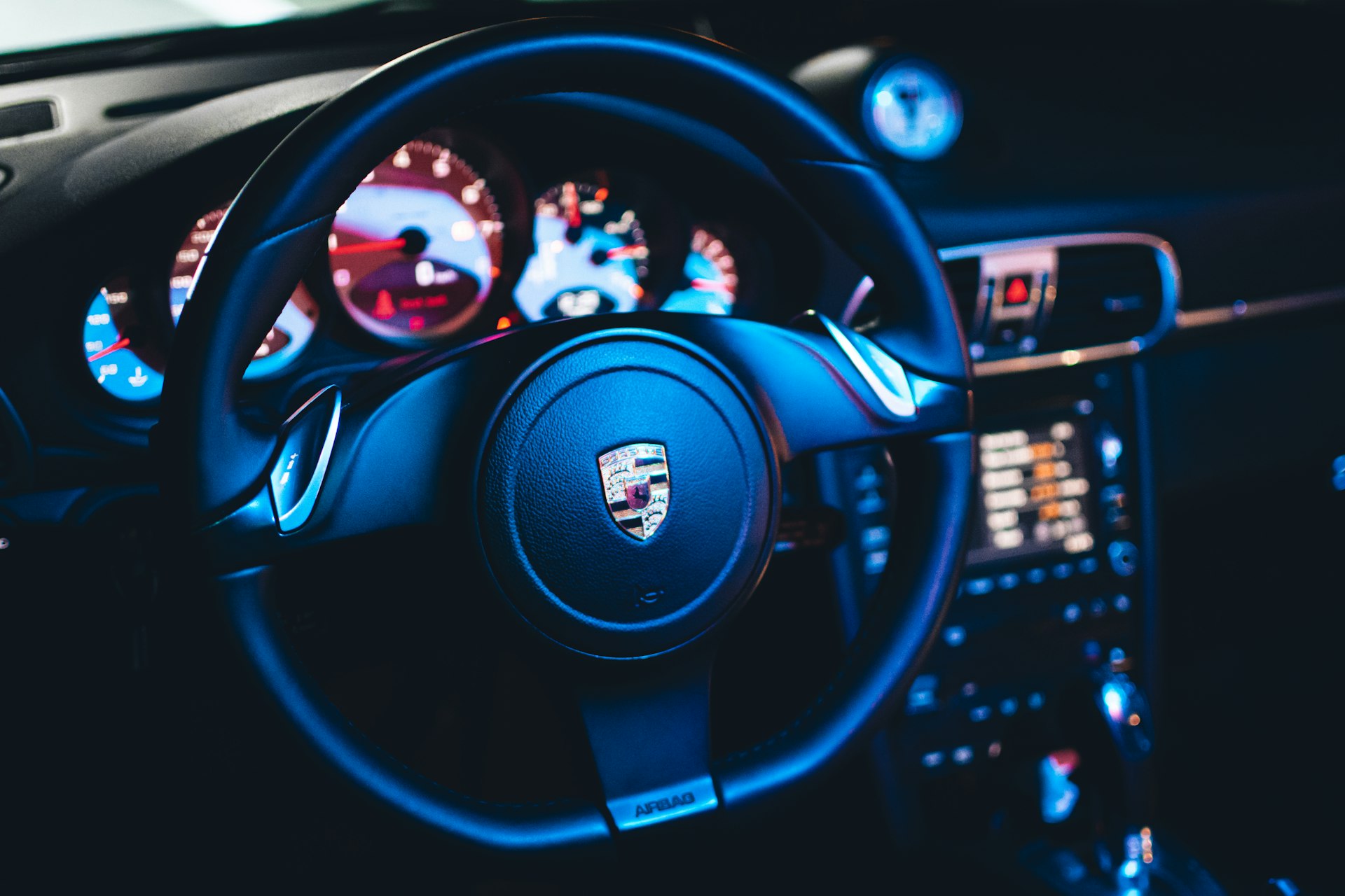 a car steering wheel and dashboard